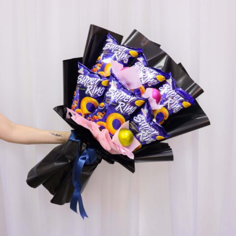 Someone holding a Vin Florist's Super Duperi RIng Bouquet