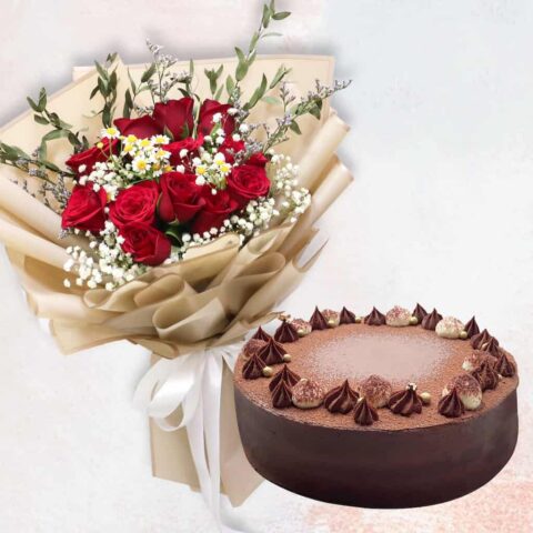 Red rose in golden wrapping and a choco raspberry cake