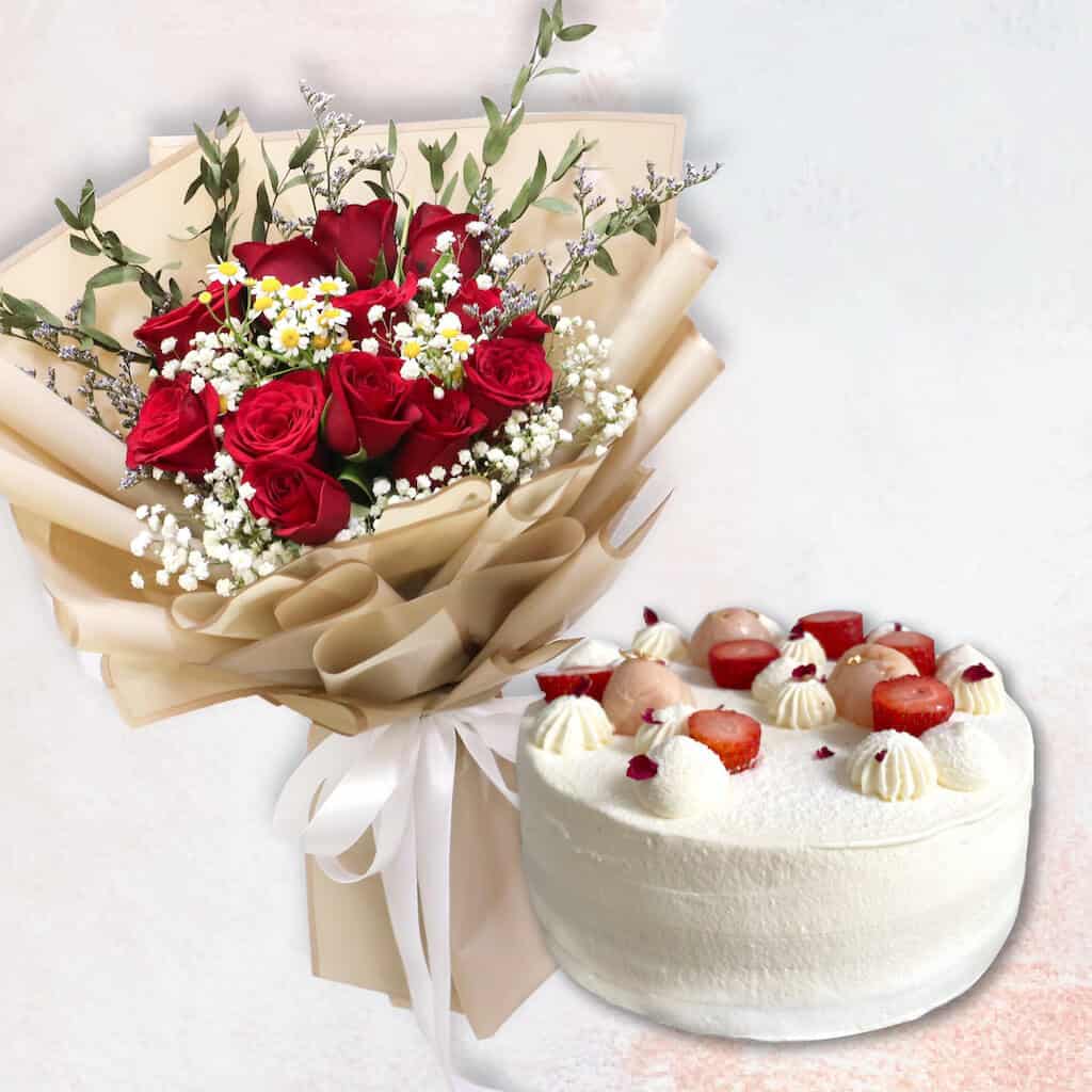 Red rose in golden wrapping and a lychee strawberry cake