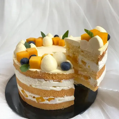 Slicing of Mango Passion Fruit Cake
