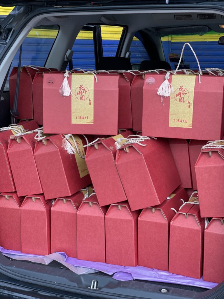 YuBake gift bags packed in a car for festive delivery