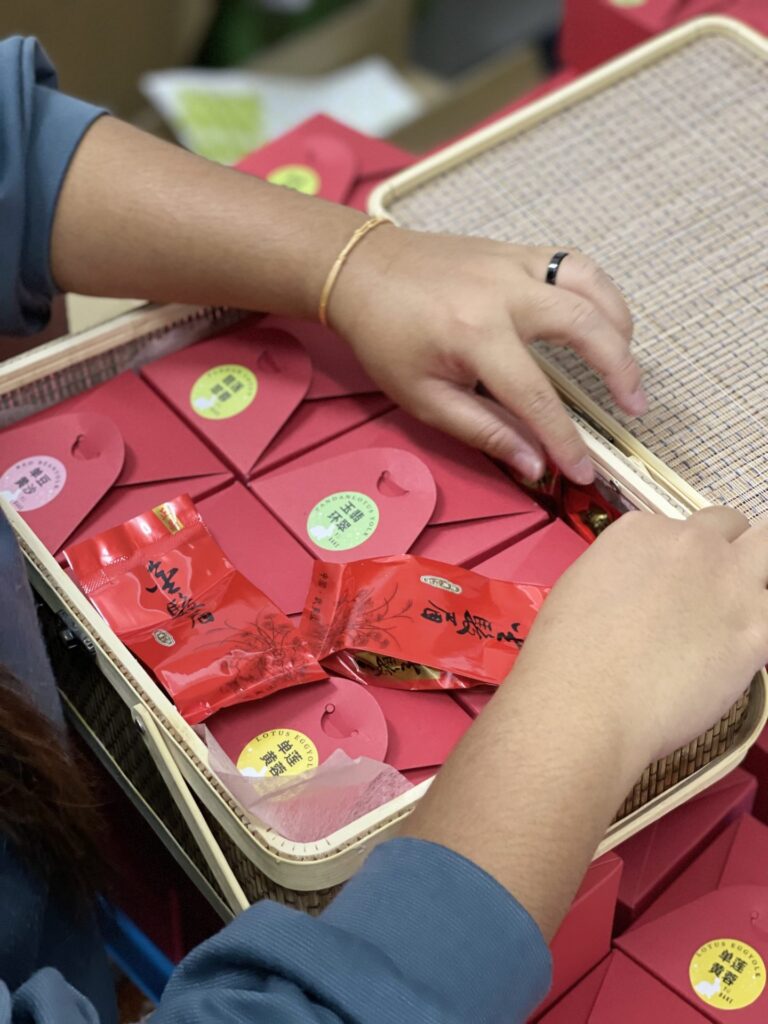 YuBake gift packs being placed carefully into a festive basket